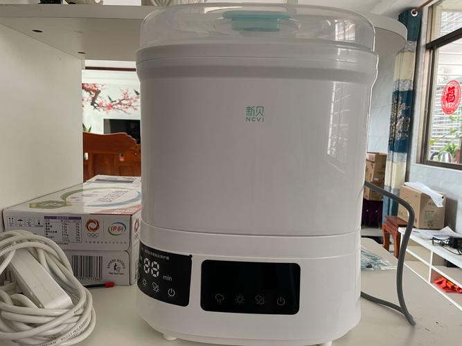 新贝婴儿奶瓶消毒器带烘干机二合一体机 宝宝专用煮奶瓶锅柜家用，消毒暖奶一机搞定